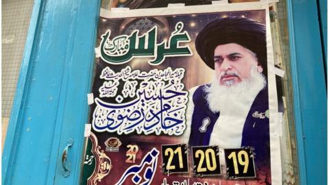 A poster of of the leader of the TLP, cleric Khadim Hussain Rizvi, is posted on the anniversary of his death