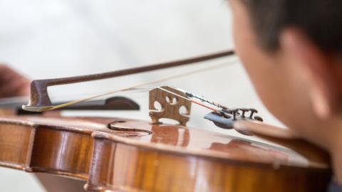 Child playing the violin