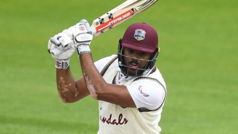 West Indies batter John Campbell plays a shot in a Test against England