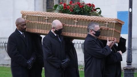 The pall bearers carry the coffin in to the funeral of Labour MP Jack Dromey at St Margaret's Church in Westminster,