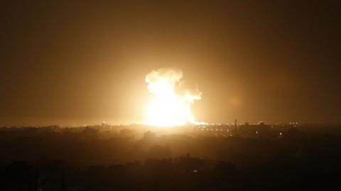 A ball of fire is seen following an Israel airstrike at Rafah in the southern Gaza Strip early on 23 February