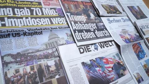 Newspaper front pages report the storming of the US Capitol on January 7, 2021 by supporters of President Donald Trump