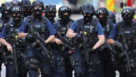 Counter terrorism officers march near the scene of the London Bridge terrorist attack, 5 June 2017