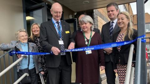 Officials cut the ribbon to open the new operating theatres