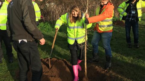 Edwina Hannaford planting the first tree