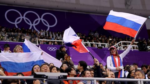 Russian fans wave their country's flag at the 2018 Winter Olympics