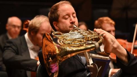 Felix Klieser playing his French Horn with Bournemouth Symphony Orchestra
