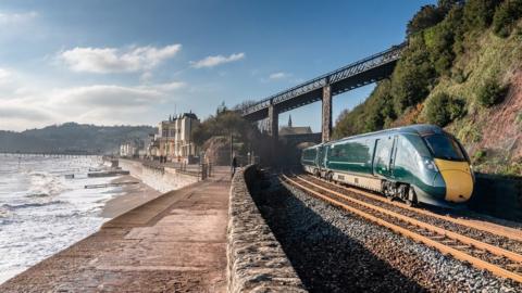 Train running along coast