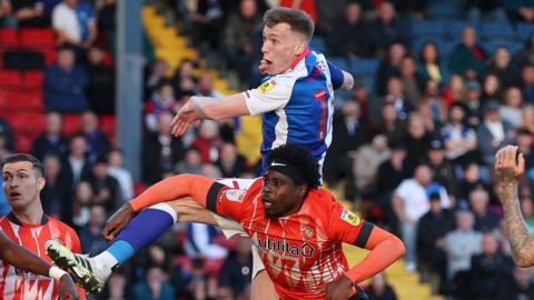 Hayden Carter leaps highest to equalise for Blackburn, getting above Amari'i Bell to score