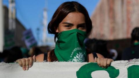 A demonstrator wearing a green handkerchief takes part during a demonstration in favour of decriminalization of abortion on 28 September