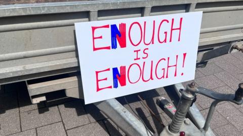 sign saying 'enough is enough'