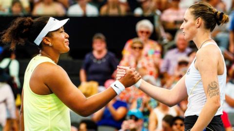 Naomi Osaka and Karolina Pliskova shake hands following their match