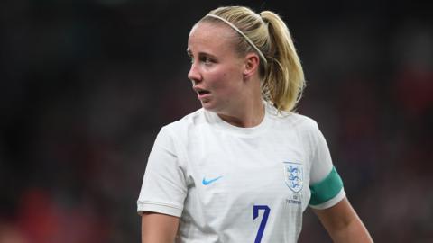 Beth Mead looks round while playing for England