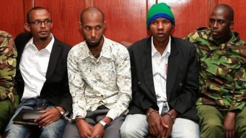 Hassan Aden Hassan (L), Mohamed Ali Abikar (3rd L) and Rashid Charles Mberesero (3rd R) sit and wait for sentencing of abetting Somali jihadists who carried out a 2015 attack on Garissa University in northeast Kenya in which 148 people were killed at Milimani law Courts in Nairobi on July 3, 2019