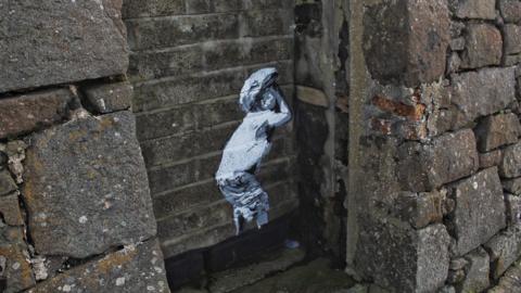 Banksy-style street art in Portstewart