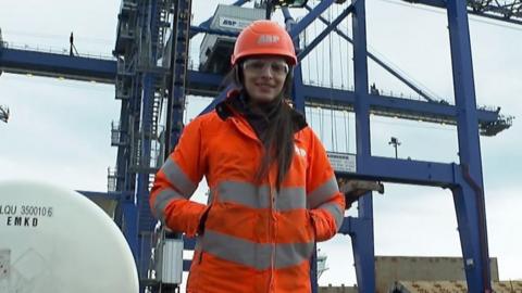 Mia Allen dressed in high-vis looking into camera