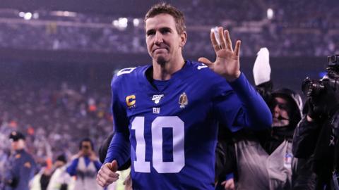 Quarterback Eli Manning waves as he leaves the field after his final game for the New York Giants