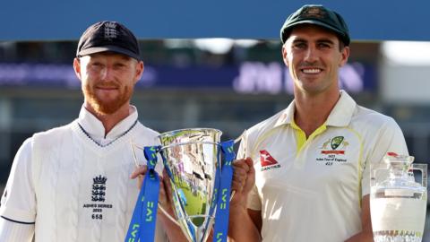 England captain Ben Stokes (left) and Australia captain Pat Cummins (right) hold up the trophy after the drawn 2023 Ashes