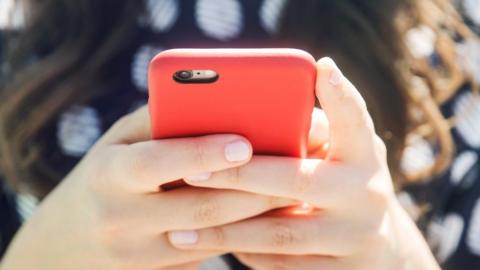 Woman holding phone