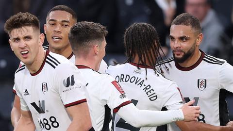 Layvin Kurzawa of Fulham (right) celebrates scoring his teams first goal with team mates during the Emirates FA Cup Third Round Match between Hull City and Fulham at MKM Stadium on January 07, 2023 in Hull