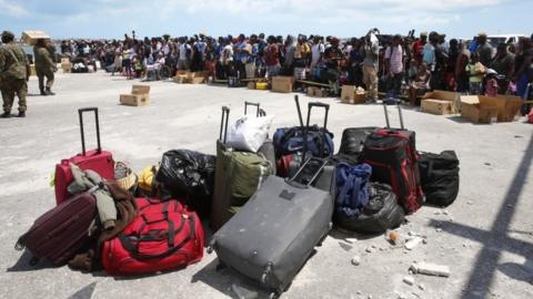 Hurricane Dorian survivors wait to evacuated in private boats at the Marsh Harbor Port on Grand Abaco Island