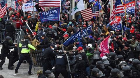 Donald Trump supporters clash with police and security forces as they push barricades to storm the US Capitol in Washington DC. Photo: 6 January 2021