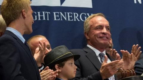 Chris Cline (right) ring the opening bell at the New York Stock Exchange. Photo: June 2014