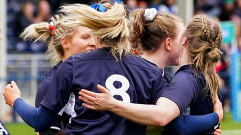 Thistles' Meryl Smith celebrates scoring a try with her team-mates during a Celtic Challenge match between The Thistles and the Combined Provinces XV