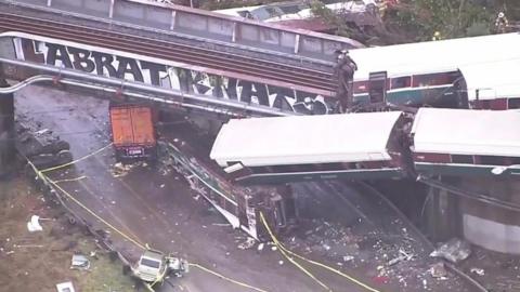 Carriages plummeted off both sides of a highway bridge in Washington state after a train derailed.