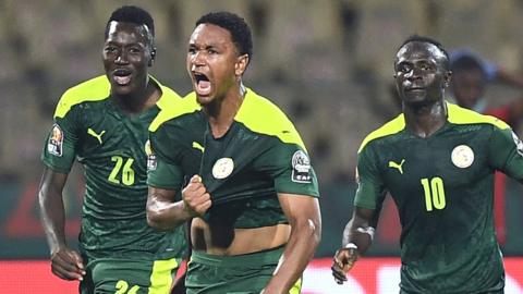 Abdou Diallo (centre) celebrates a goal for Senegal