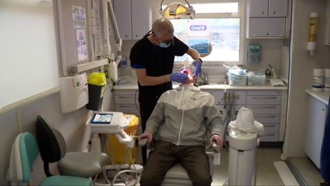 Rob being treated by dentist Geoff Baggaley