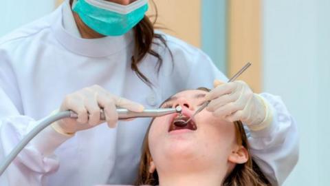 Girl receiving dental care