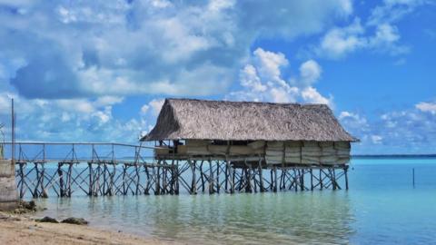 Beach pier and hut on stilts, Tarawa, Kiribati