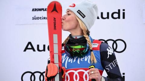 Mikaela Shiffrin celebrates on the podium