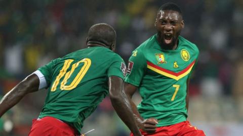 Cameroon players celebrate a goal