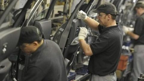 Nissan technicians prepare doors for the Qashqai car at the company"s plant in Sunderland