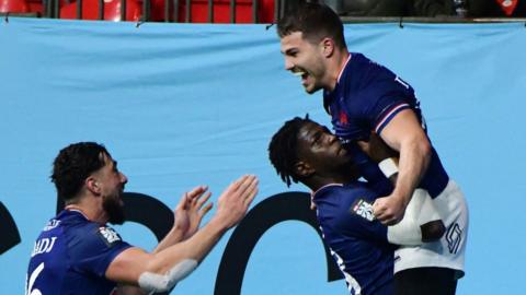 Antoine Dupont celebrates with his team-mates