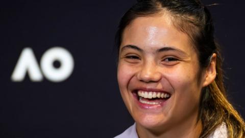 Emma Raducanu laughs during an Australian Open news conference