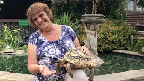 Ann Ovenstone with a tortoise