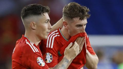 Wales' Harry Wilson and David Brooks look dejected after defeat to Armenia