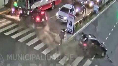 Woman narrowly misses being by two cars