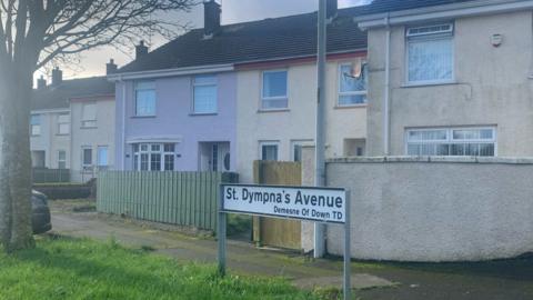 Street sign that reads: 'St Dympna's Avenue' in Downpatrick