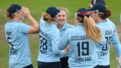 Charlie Dean celebrates a wicket for England