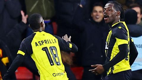 Tom Dele-Bashiru of Watford celebrates scoring the winner against Chesterfield