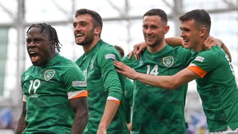 Michael Obafemi celebrates his goal against Scotland