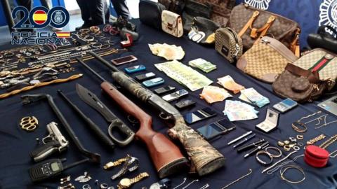 Stash of jewellery, bags, watches, mobile phones, cash and weapons found by Spanish police
