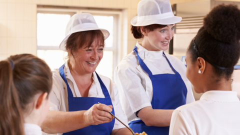 Pupils being served a school meal