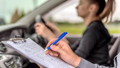Stock image of a woman taking her driving test