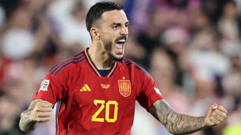 Joselu celebrates scoring for Spain