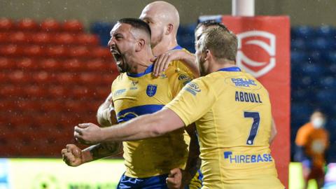 Elliot Minchella celebrates Hull KR's opening try